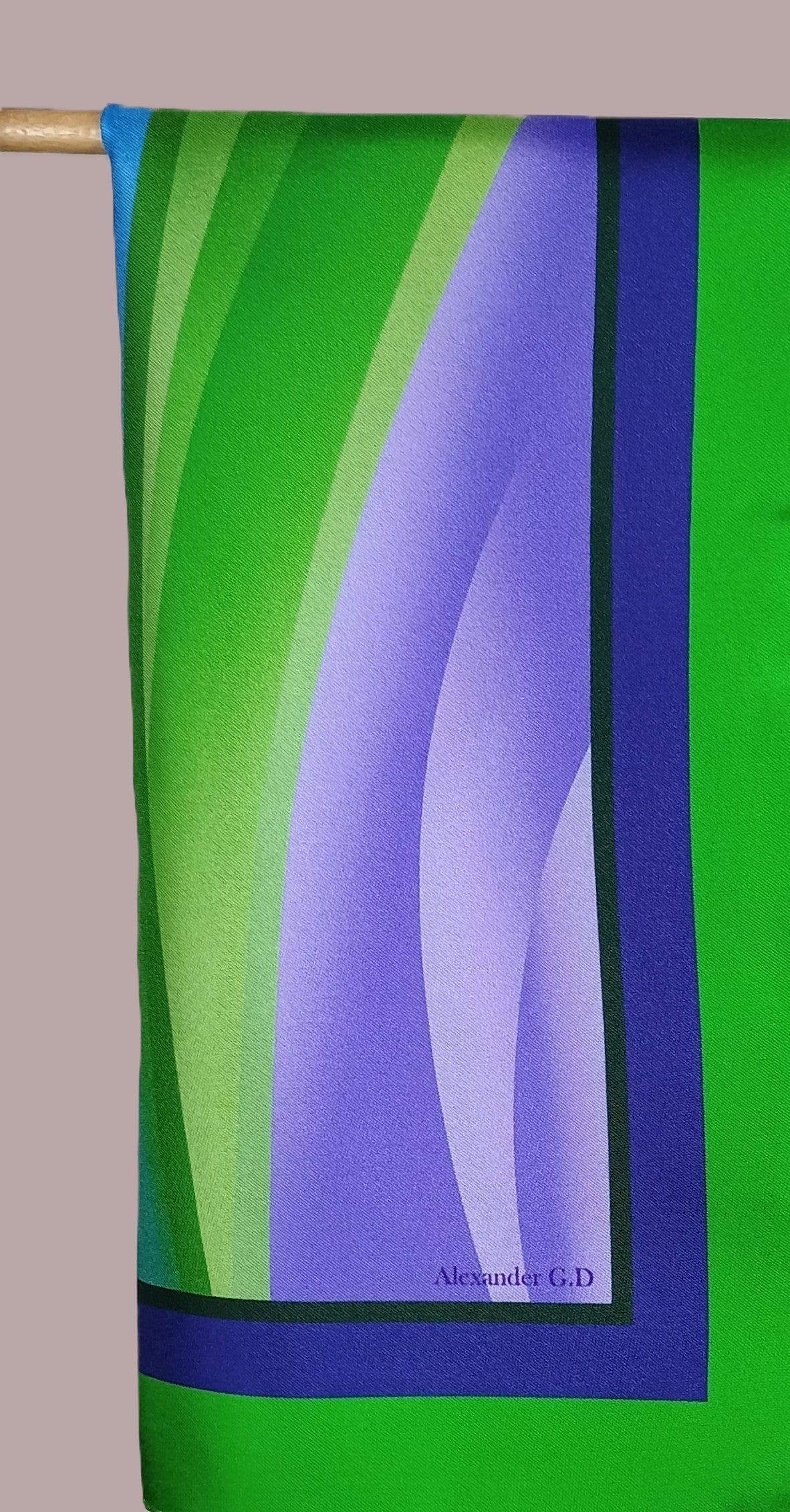 Multicolor and shades of repetitive silk scarf darped softly with its printed slogan 