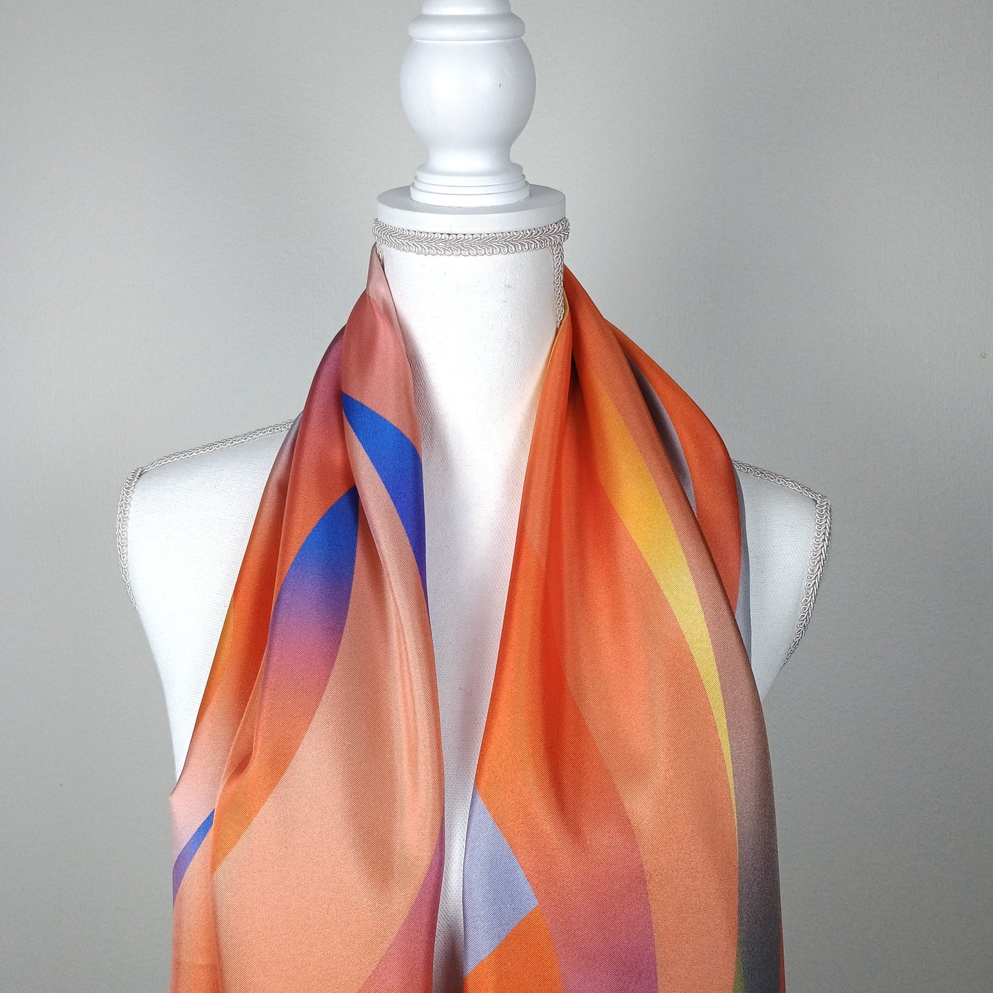 Orange gradient silk scarf 68x180 for women layed around the necked