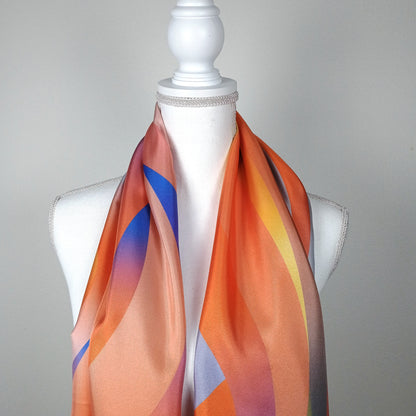 Orange gradient silk scarf 68x180 for women layed around the necked